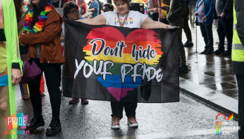 Woman holding Pride flag
